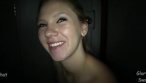 Natalie has fun in a gloryhole session